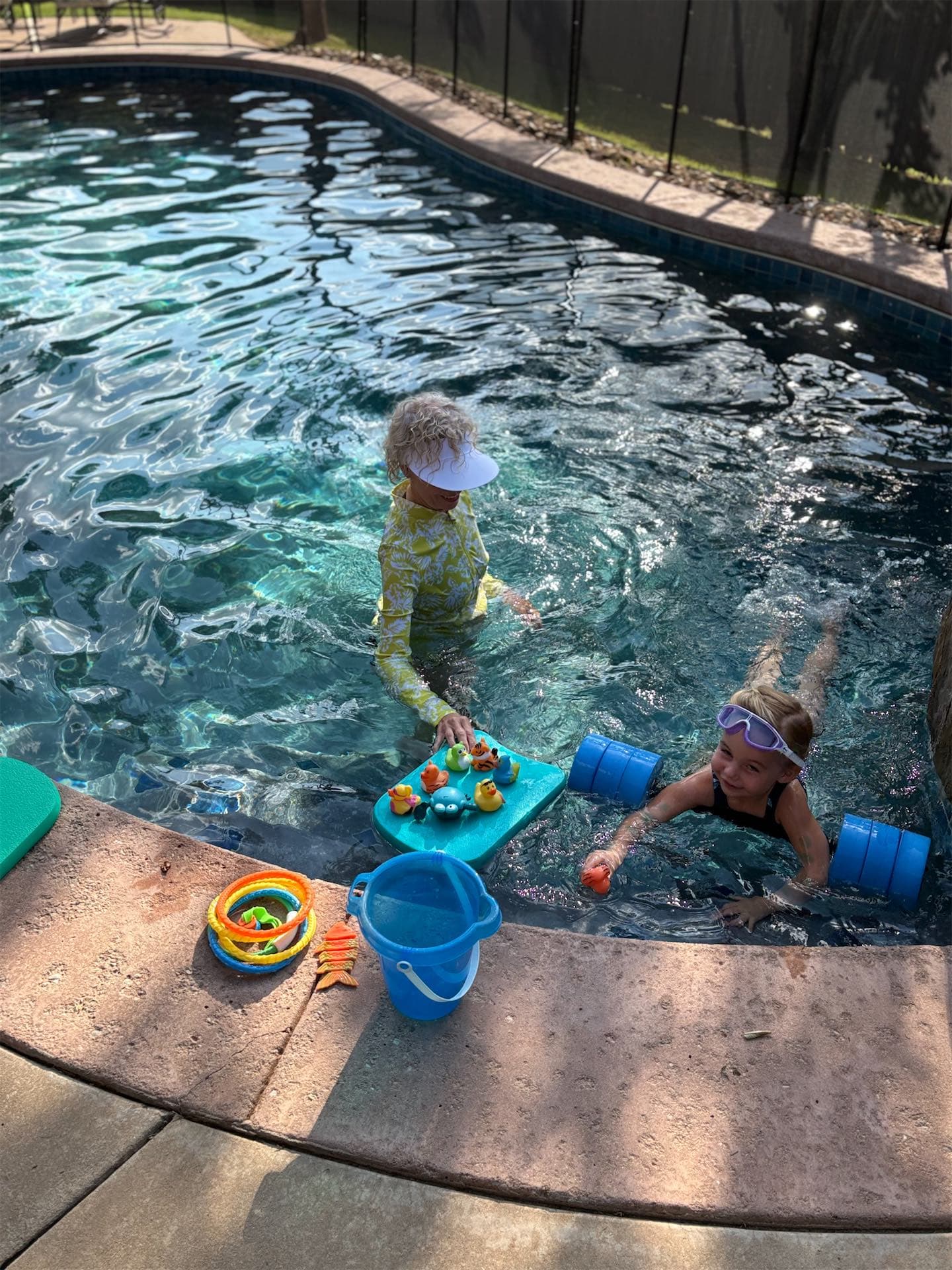 Toddler learning to back-float during swim lesson in Edmond, Oklahoma