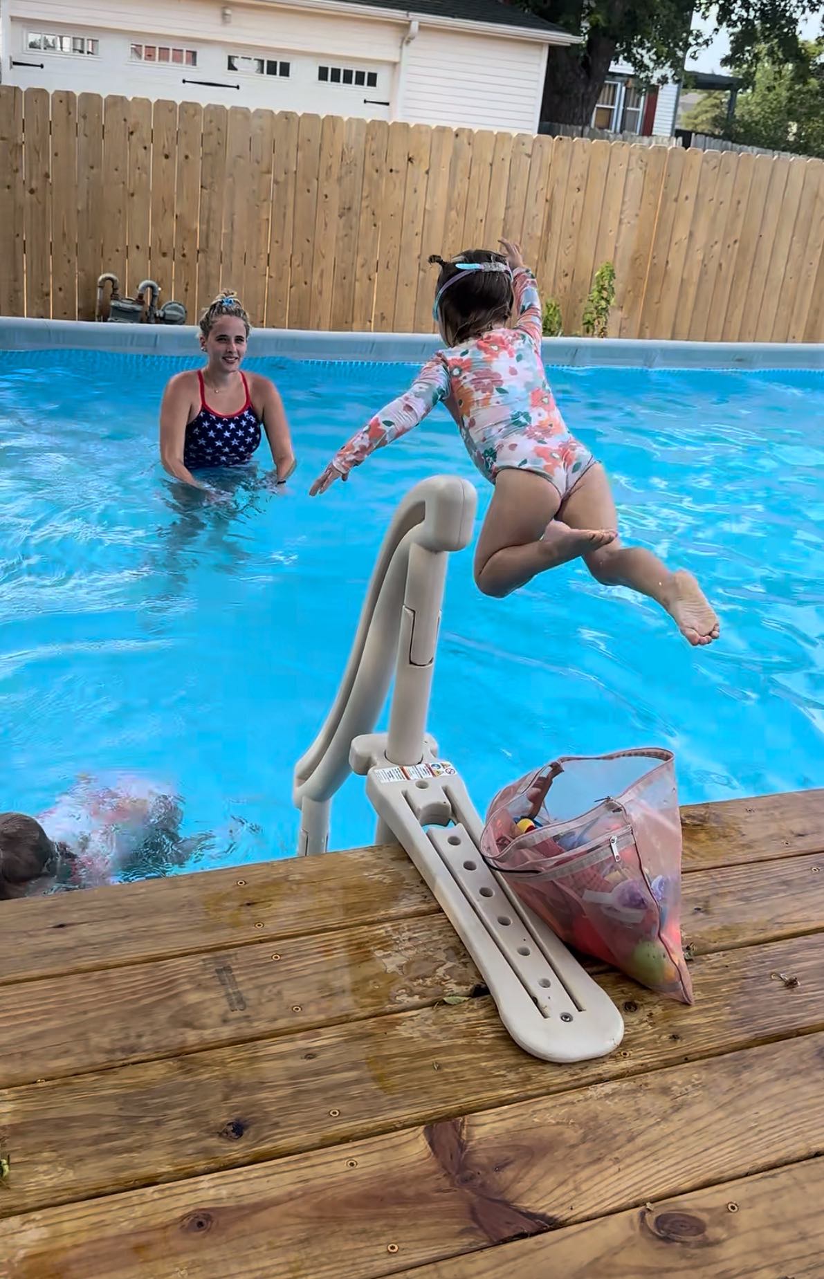 Like a Fish swim coach guiding a child through the water in Guthrie, OK